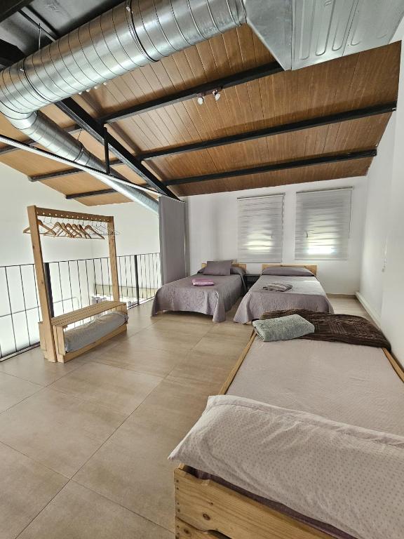Postel nebo postele na pokoji v ubytování Alojamiento El Pez Casa con piscina climatizada