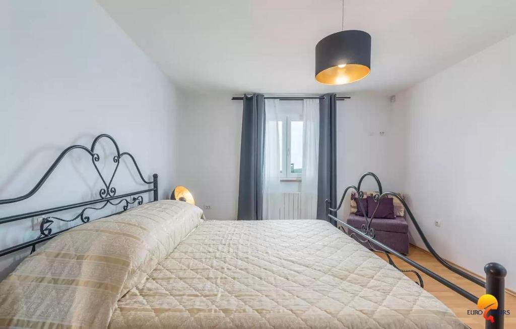 Postel nebo postele na pokoji v ubytování Villa Grguci