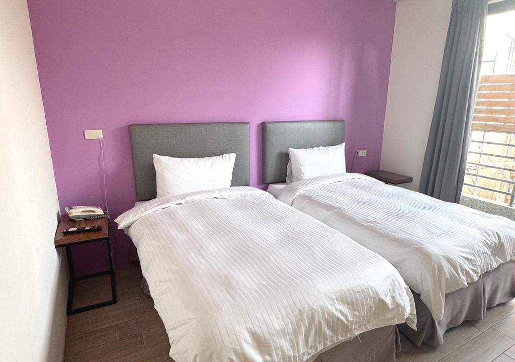 Postel nebo postele na pokoji v ubytování Happy Guesthouse