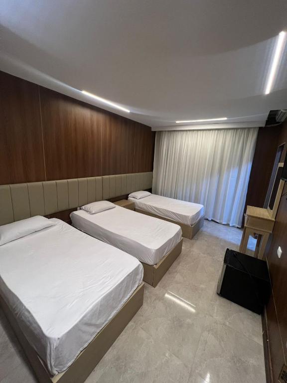 Postel nebo postele na pokoji v ubytování City Hotel
