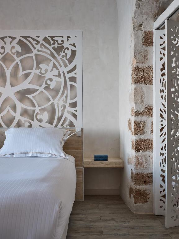 Postel nebo postele na pokoji v ubytování Domus Fresco