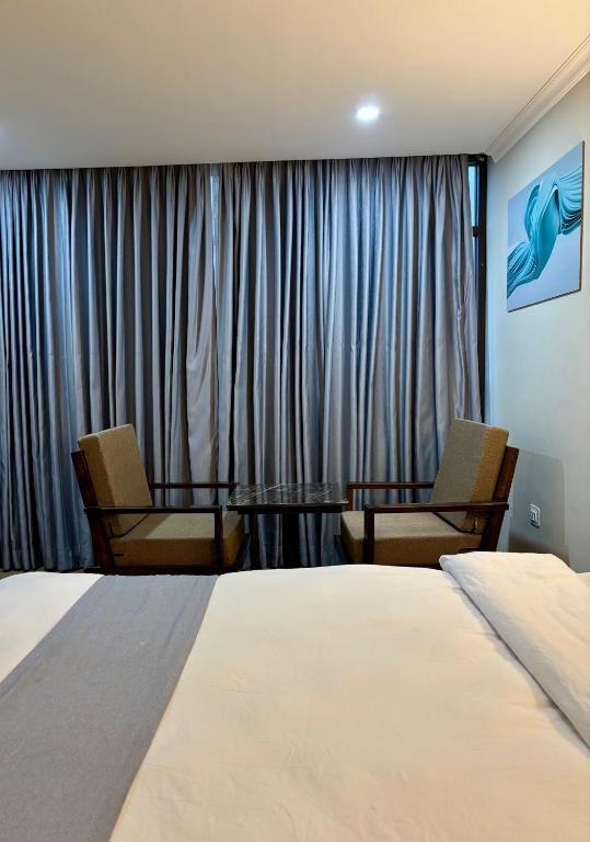 Voodi või voodid majutusasutuse Hotel Gulmohar toas