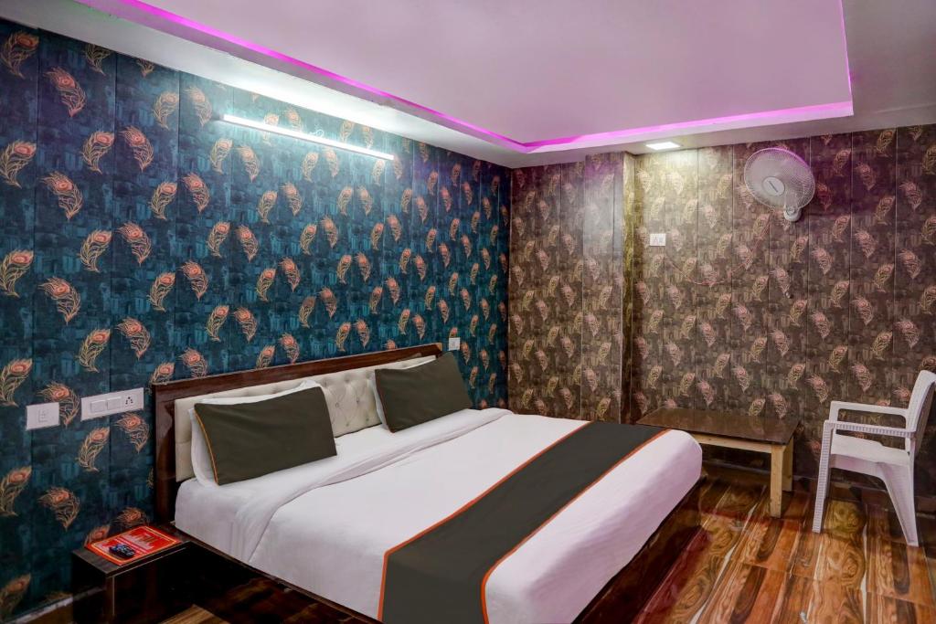 Postel nebo postele na pokoji v ubytování OYO 81208 HOTEL TERRENE EMPIRe