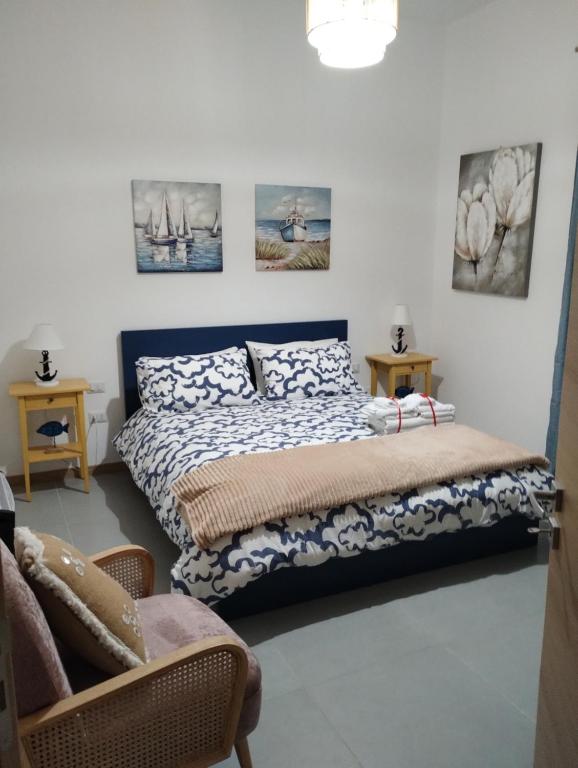 Ένα ή περισσότερα κρεβάτια σε δωμάτιο στο Residence Spiaggia Centro - Aria Condizionata Wi-Fi&SelfCheck-In - Sole&Mare Home