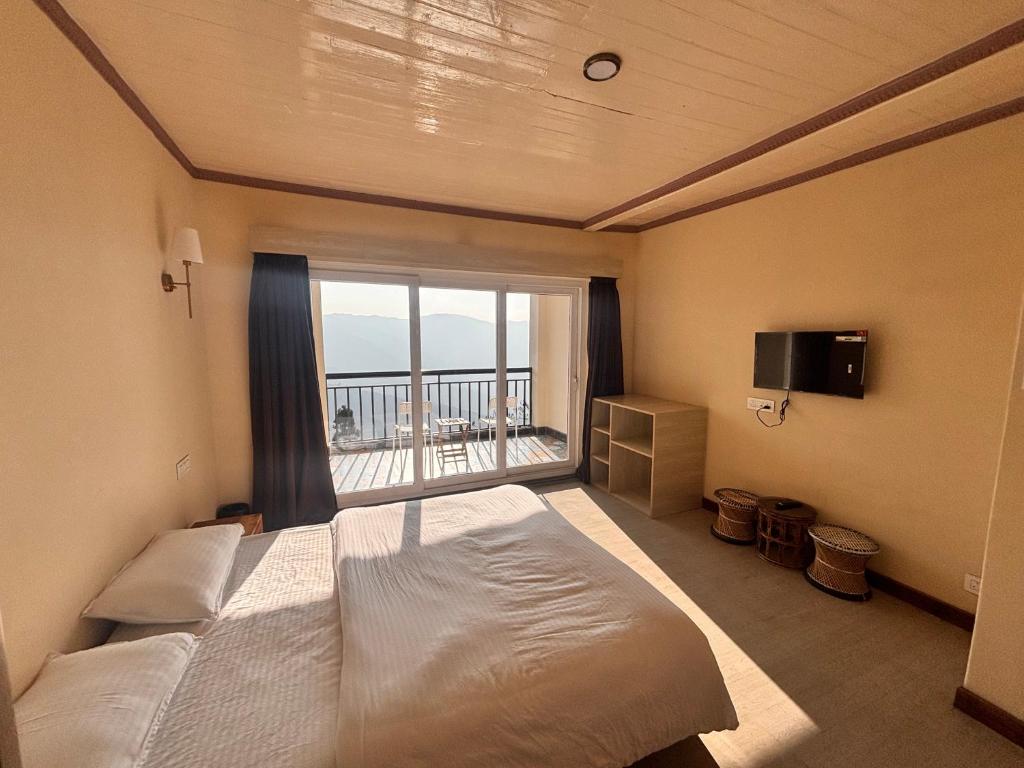 Postel nebo postele na pokoji v ubytování Asraya Homestay