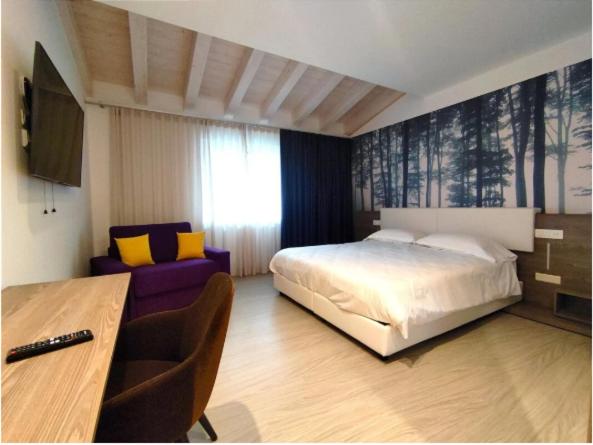 Posteľ alebo postele v izbe v ubytovaní Hotel Luna