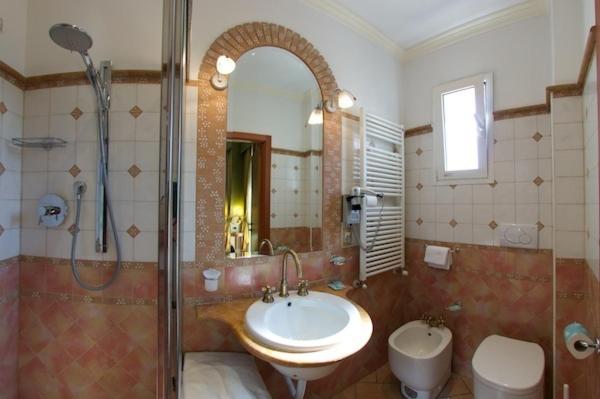 Koupelna v ubytování Hotel Pedrini