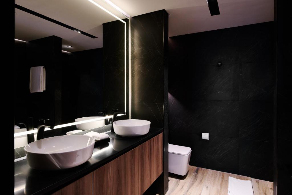 Ein Badezimmer in der Unterkunft The OQ