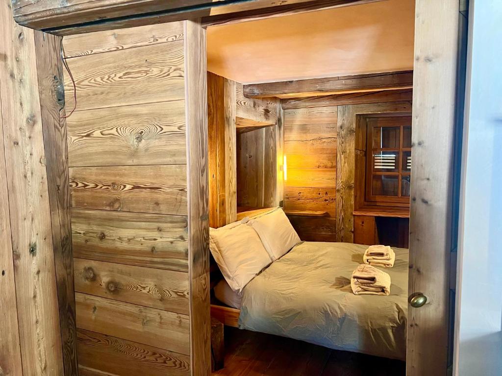 Postel nebo postele na pokoji v ubytování Casalpina Cozy chalet