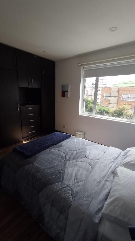 Postel nebo postele na pokoji v ubytování Casa Yolo Bogotá