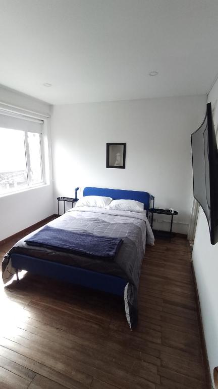 Postel nebo postele na pokoji v ubytování Casa Yolo Bogotá