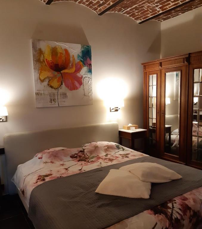 Postel nebo postele na pokoji v ubytování De Verborgen Parel B&B