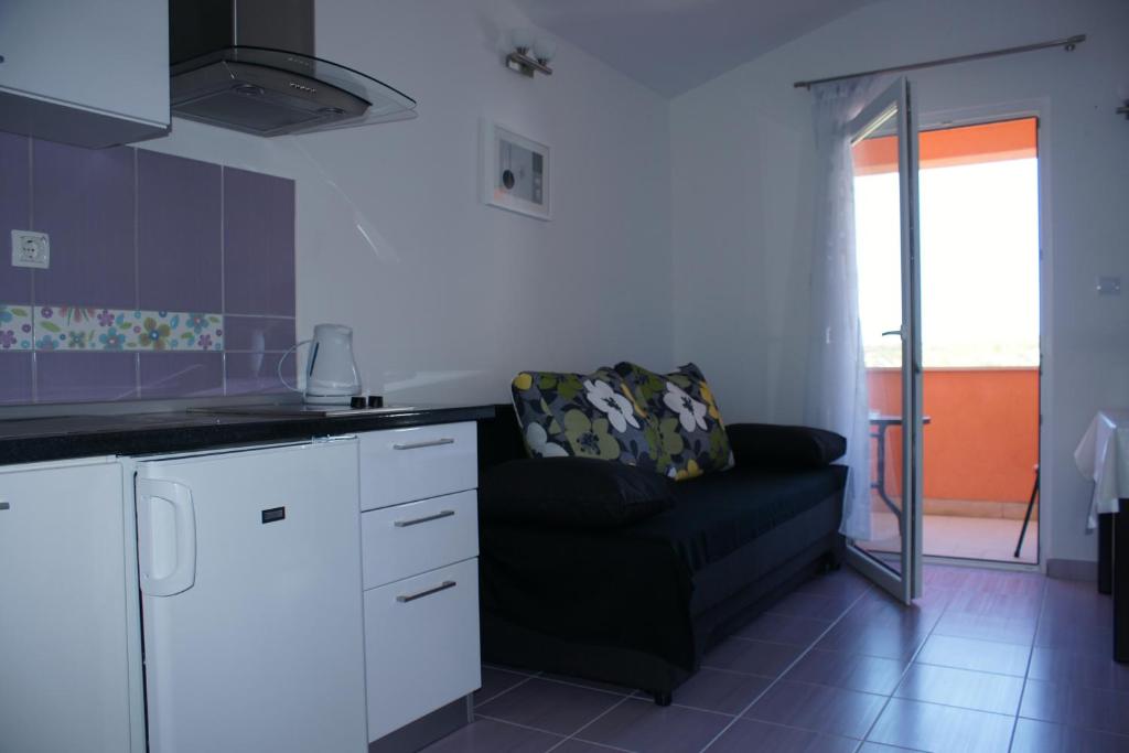 Kuchyňa alebo kuchynka v ubytovaní Apartments Villa Rosina