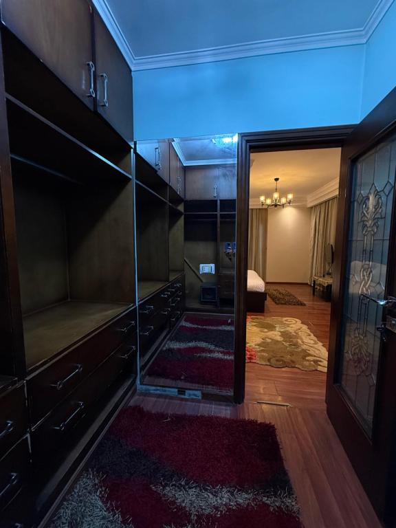 Postel nebo postele na pokoji v ubytování Grand Apartment Pyramids