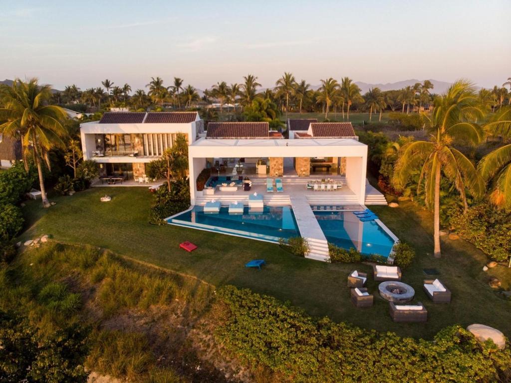 an aerial view of a villa with a swimming pool at Casa Brisa Luxury on The Beach in Punta Mita