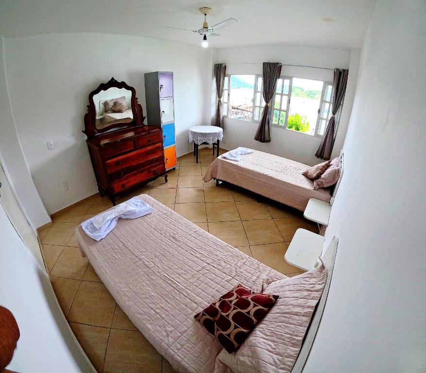 Postel nebo postele na pokoji v ubytování Hostel Chico Lessa