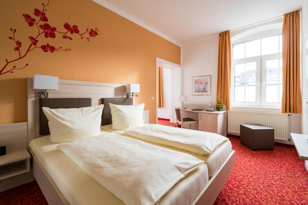 Postel nebo postele na pokoji v ubytování Hotel Gorch Fock