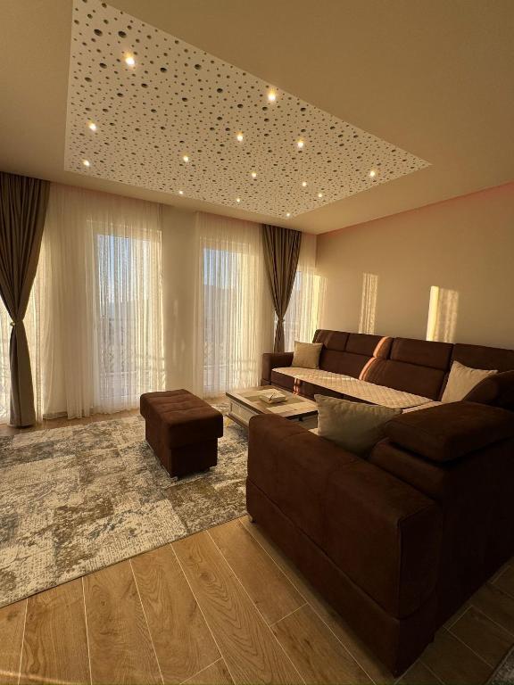 a large living room with a couch and a table at Crown Apartmani Vlašić in Vlasic