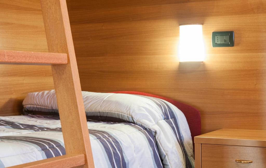 Postel nebo postele na pokoji v ubytování Hotel Edelweiss con Ristorante Note di Gusto