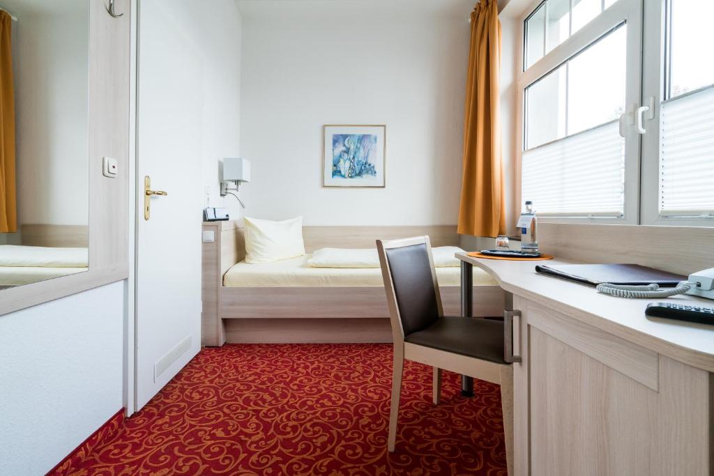 Postel nebo postele na pokoji v ubytování Hotel Gorch Fock