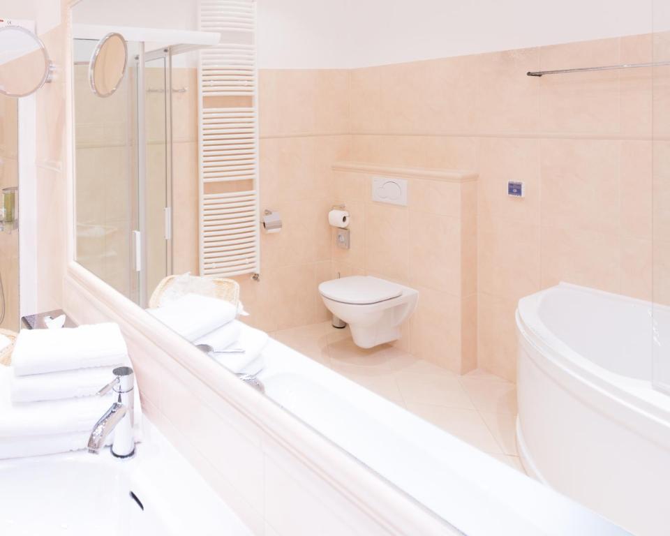 Koupelna v ubytování Unitas Hotel