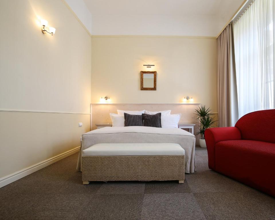 Postel nebo postele na pokoji v ubytování Unitas Hotel