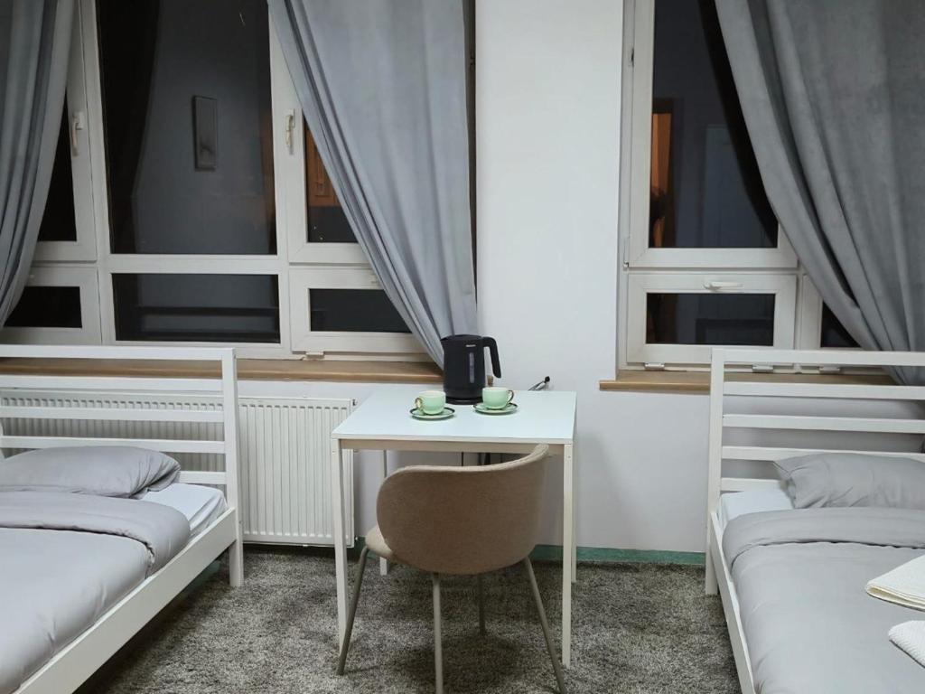 Postel nebo postele na pokoji v ubytování Alliance Hostel