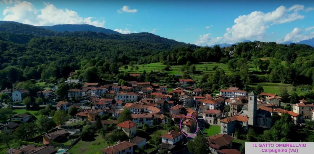 an aerial view of a village in the mountains at Il Gatto Ombrellaio - Gateway to Stresa, Lake Maggiore and Mountains in Stropino