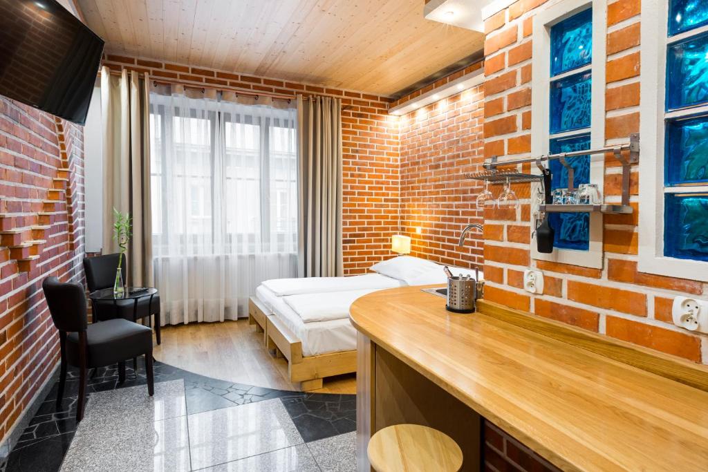 Posteľ alebo postele v izbe v ubytovaní Krowoderska Apartments