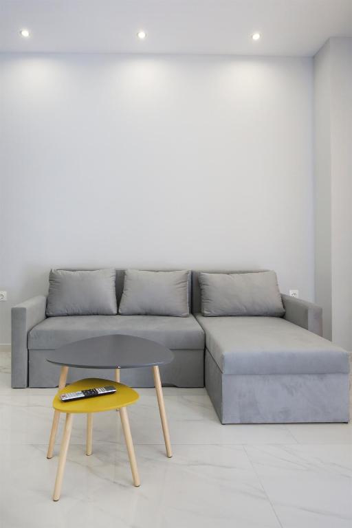 a living room with a couch and a table at #1 Ioanna Apartments in Thessaloniki