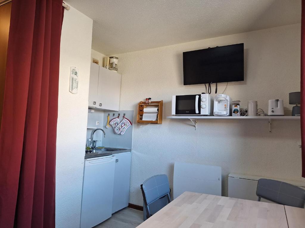 Kuchyň nebo kuchyňský kout v ubytování Studio Kandahar - Les 2 Alpes