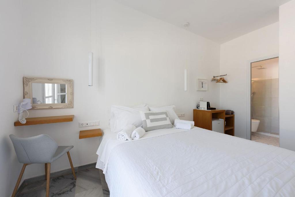 Postel nebo postele na pokoji v ubytování Vounali Rooms