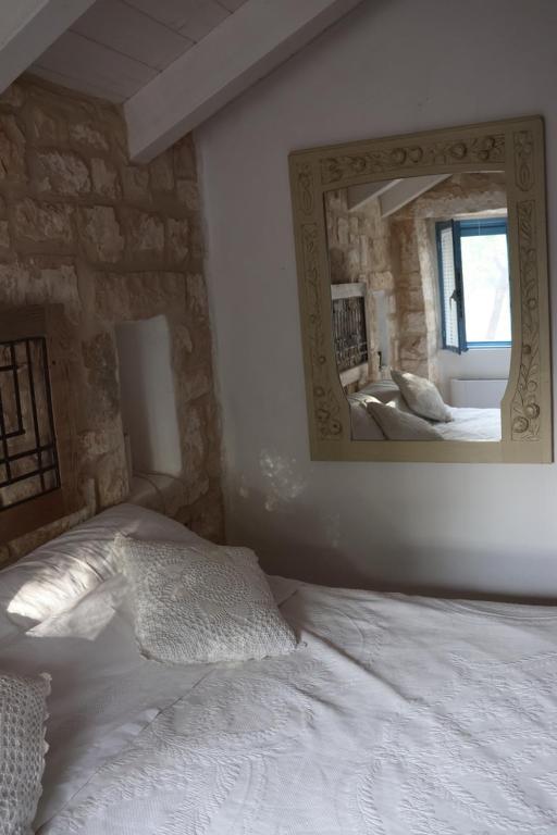 Postel nebo postele na pokoji v ubytování Trulli alla Controra