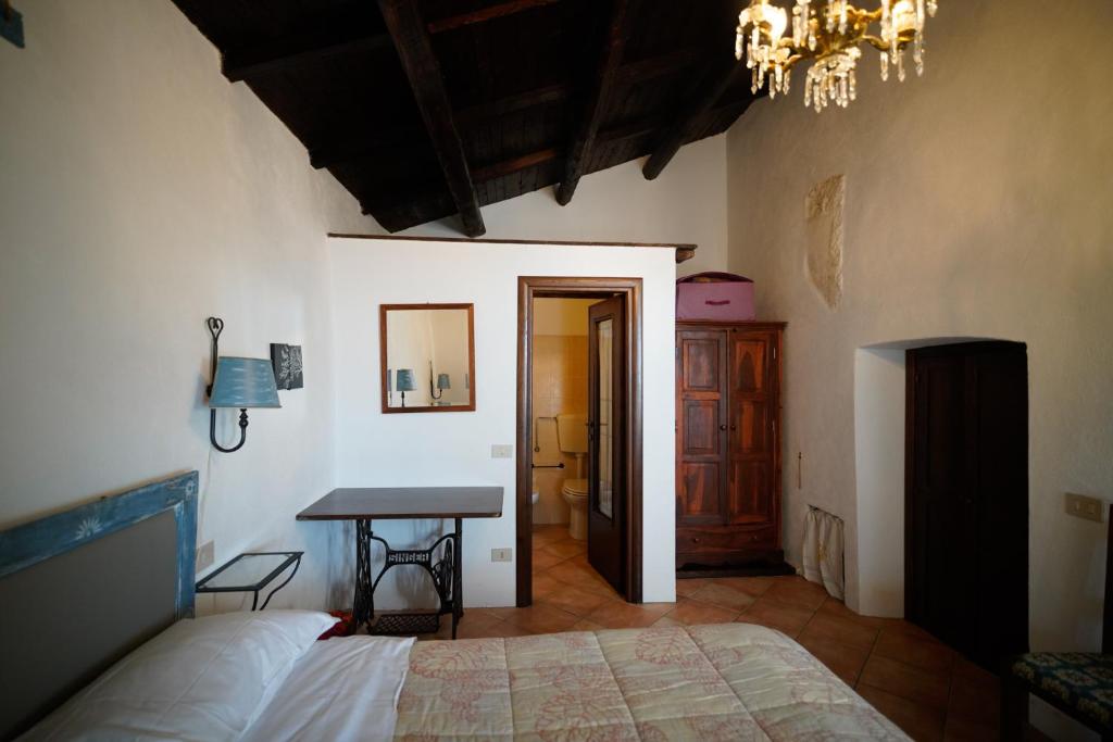 Postel nebo postele na pokoji v ubytování La Taberna di Rocca Calascio