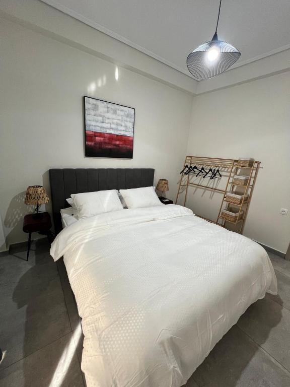 Postel nebo postele na pokoji v ubytování Feels Like Home 2 - Agrinio Suites