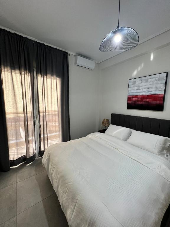 Postel nebo postele na pokoji v ubytování Feels Like Home 2 - Agrinio Suites