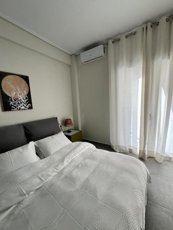 Postel nebo postele na pokoji v ubytování Feels Like Home 2 - Agrinio Suites