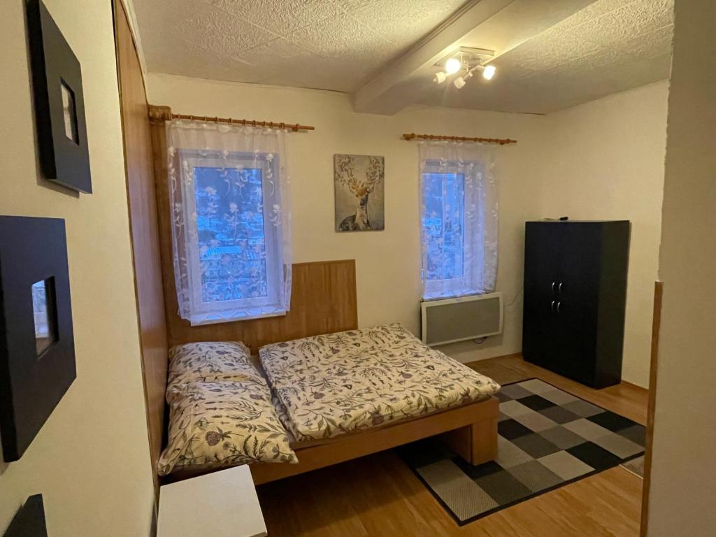 Postel nebo postele na pokoji v ubytování Horský apartmán