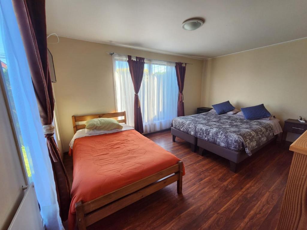 Postel nebo postele na pokoji v ubytování Hospedajes Roma