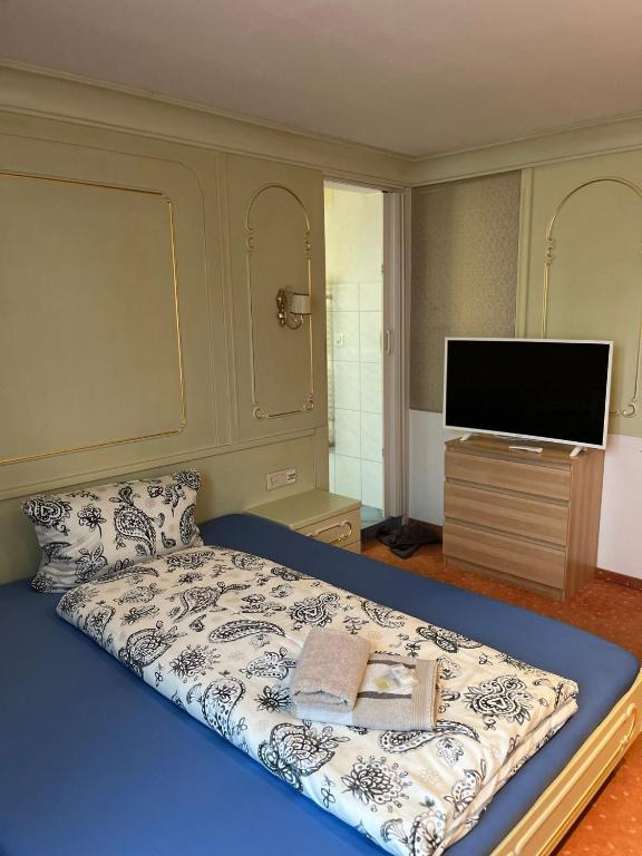 Postel nebo postele na pokoji v ubytování Hotel Bären Amriswil