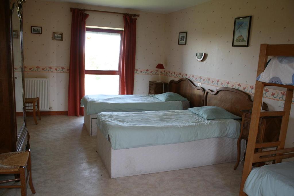 Postel nebo postele na pokoji v ubytování Le Petit Manoir - Jean Gédouin