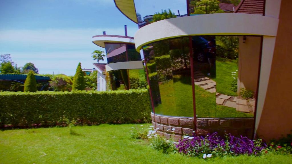 a building with a large window on the side of it at La Casa Savanna in Naivasha
