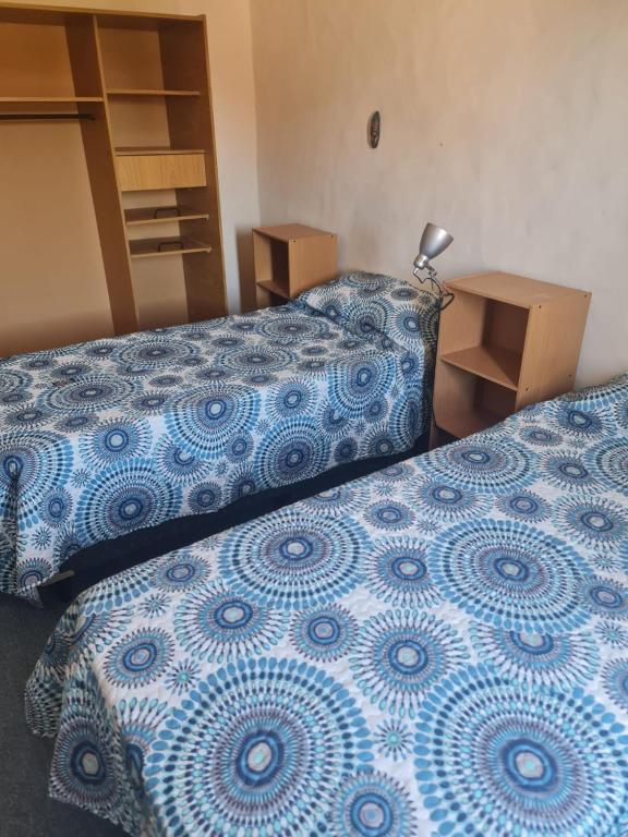 Voodi või voodid majutusasutuse Duplex 4pax Playa Unión toas