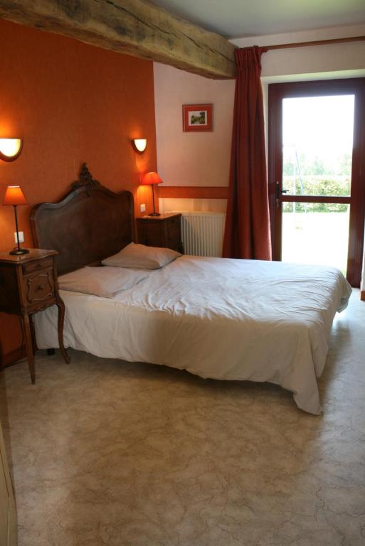 Postel nebo postele na pokoji v ubytování Le Petit Manoir - Jean Gédouin
