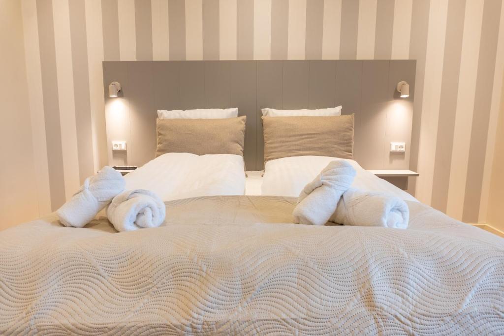Postel nebo postele na pokoji v ubytování Hotel Ulfborg