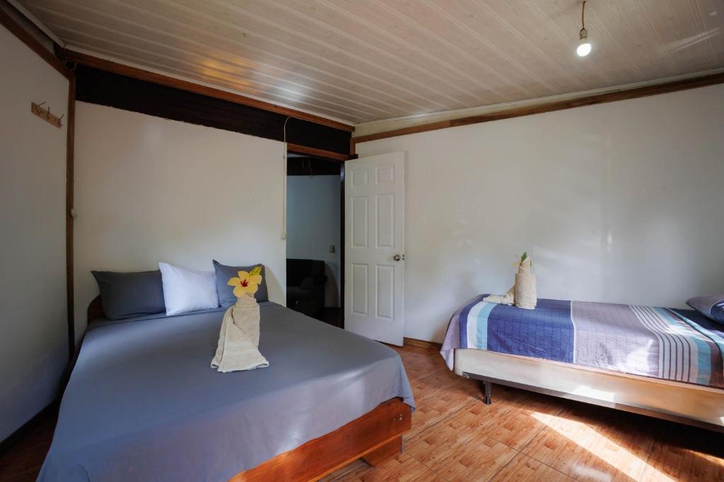 Postel nebo postele na pokoji v ubytování Bungalows Aché Cahuita