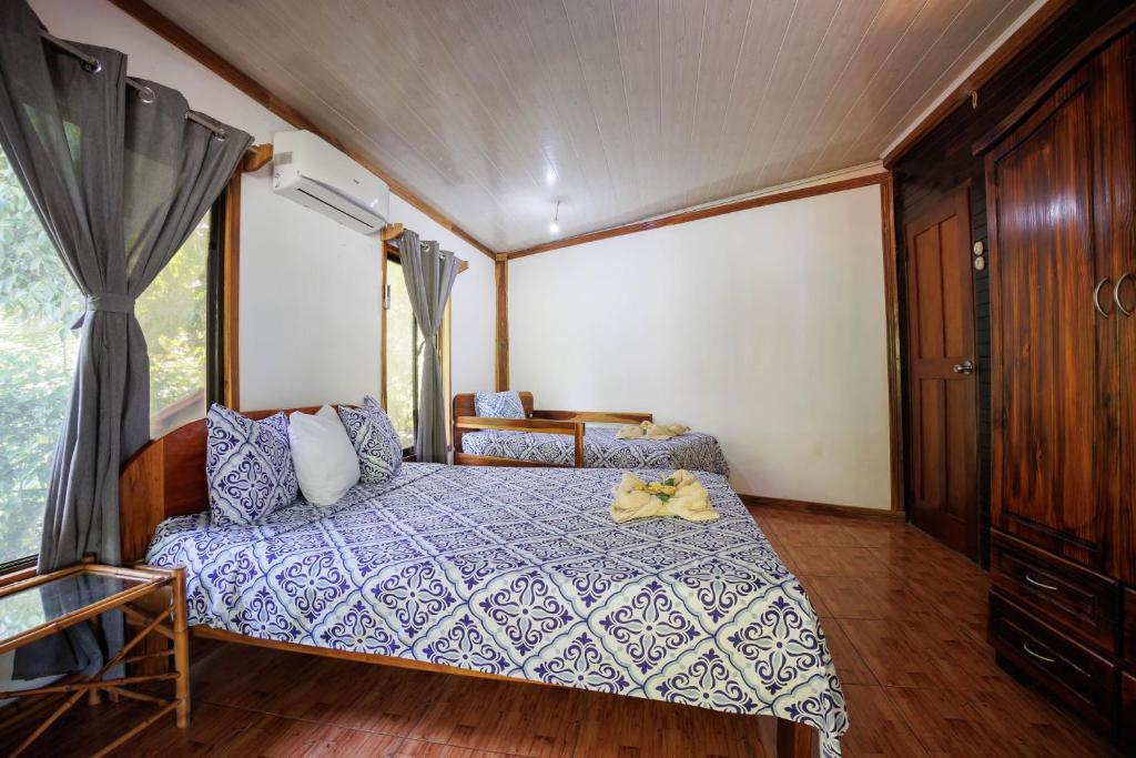 Postel nebo postele na pokoji v ubytování Bungalows Aché Cahuita