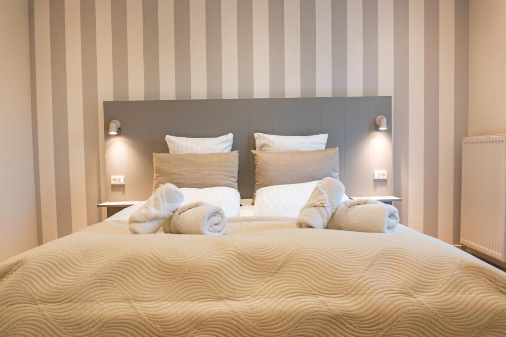 Postel nebo postele na pokoji v ubytování Hotel Ulfborg