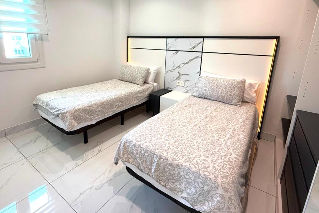 Posteľ alebo postele v izbe v ubytovaní MI CAPRICHO A12 - Luxury Beachfront Apartment- Costa del Sol