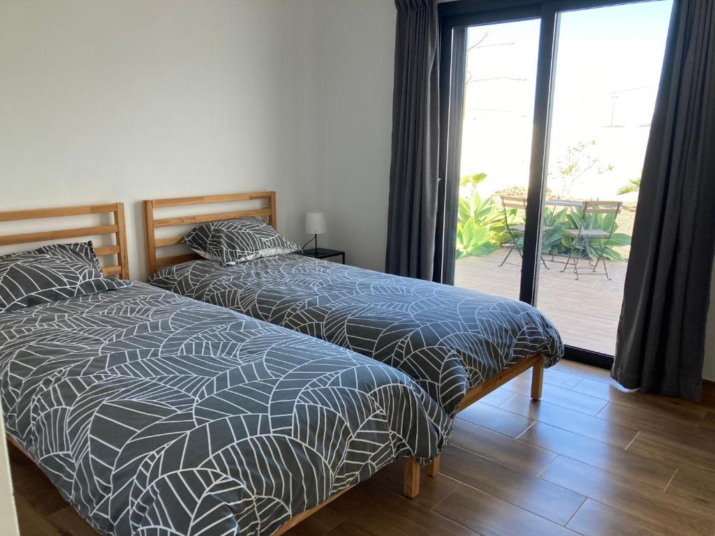 Postel nebo postele na pokoji v ubytování Villa Chona